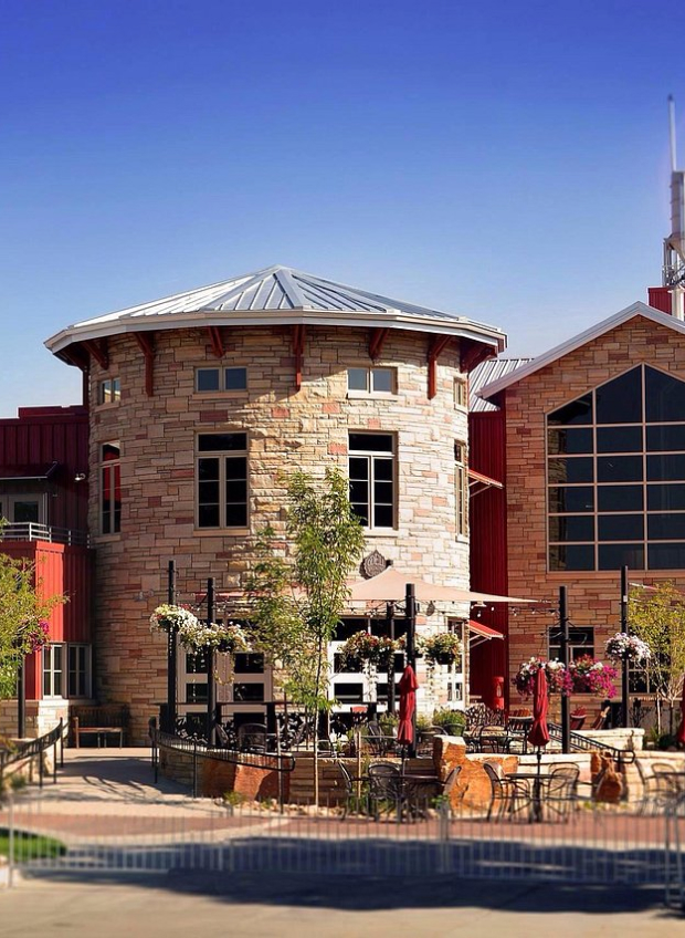 Modern stone building with outdoor seating area